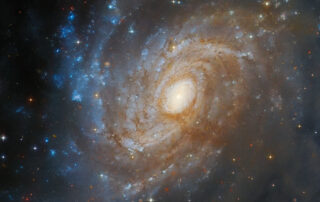 hubble-spots-a-galaxy-hidden-in-a-dark-cloud