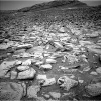 sols-4398-4401:-holidays-ahead,-rocks-under-the-wheels