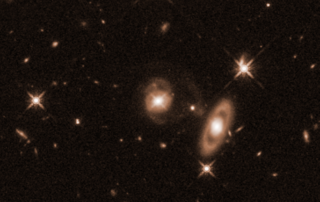 hubble-reveals-surprising-spiral-shape-of-galaxy-hosting-young-jet