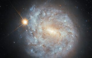 hubble-sees-a-spiral-and-a-star