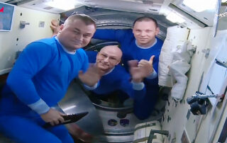 astronaut,-cosmonauts-board-soyuz;-close-hatch-for-departure