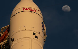 Moon Seen Shining on Full Artemis II Stack at Launch Pad 39B