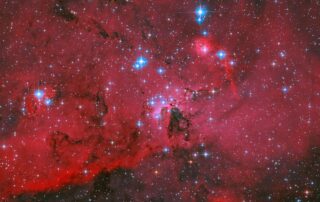 hubble-sees-crimson-cloud-and-stars